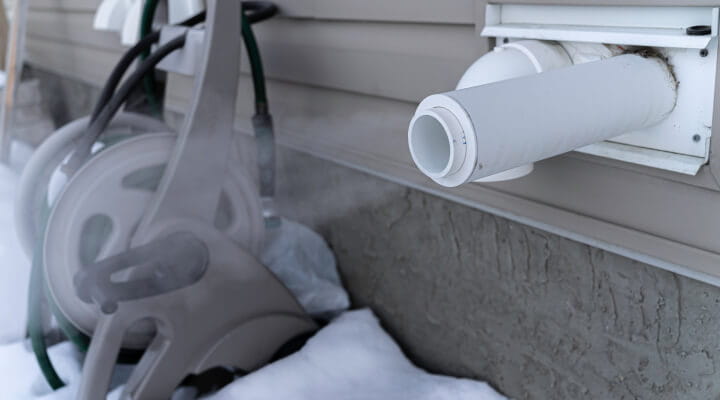 An outdoor vent expelling air.