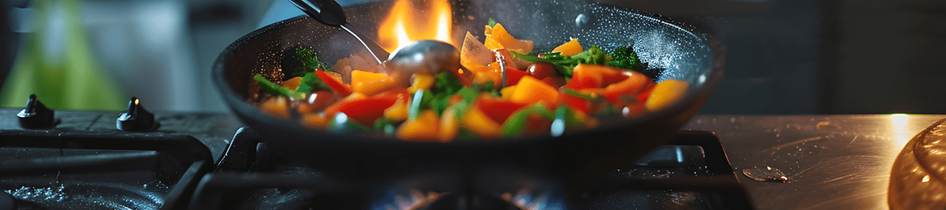 Girl cooking on gas stove
