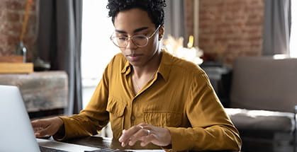 A woman using a laptop computer