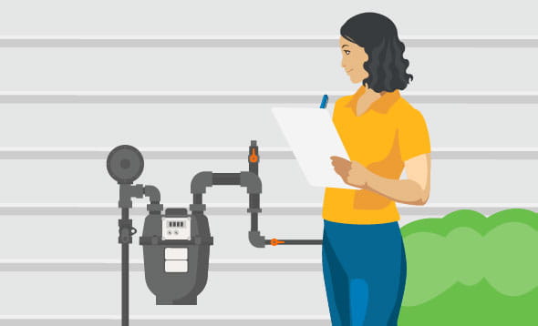 Woman inspecting the meter and making notes